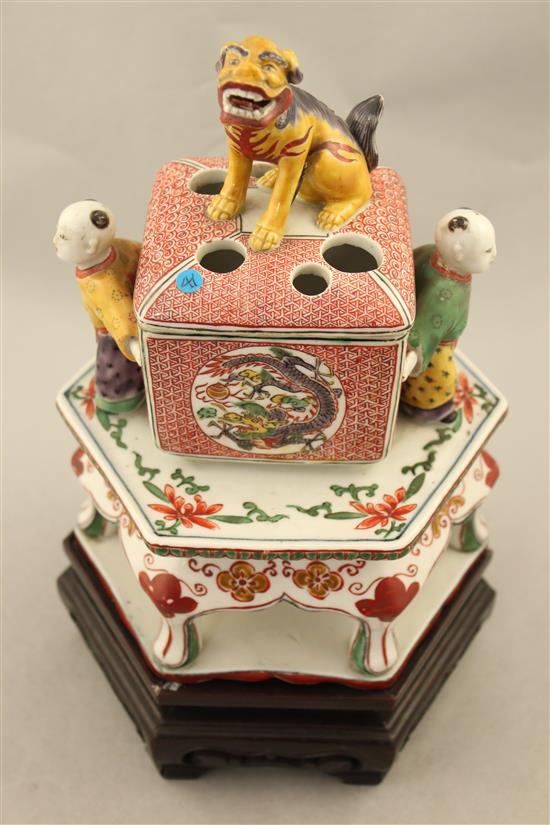 A Japanese Kutani koro and cover, 19th century, 22.5cm, wood stand, restorations
